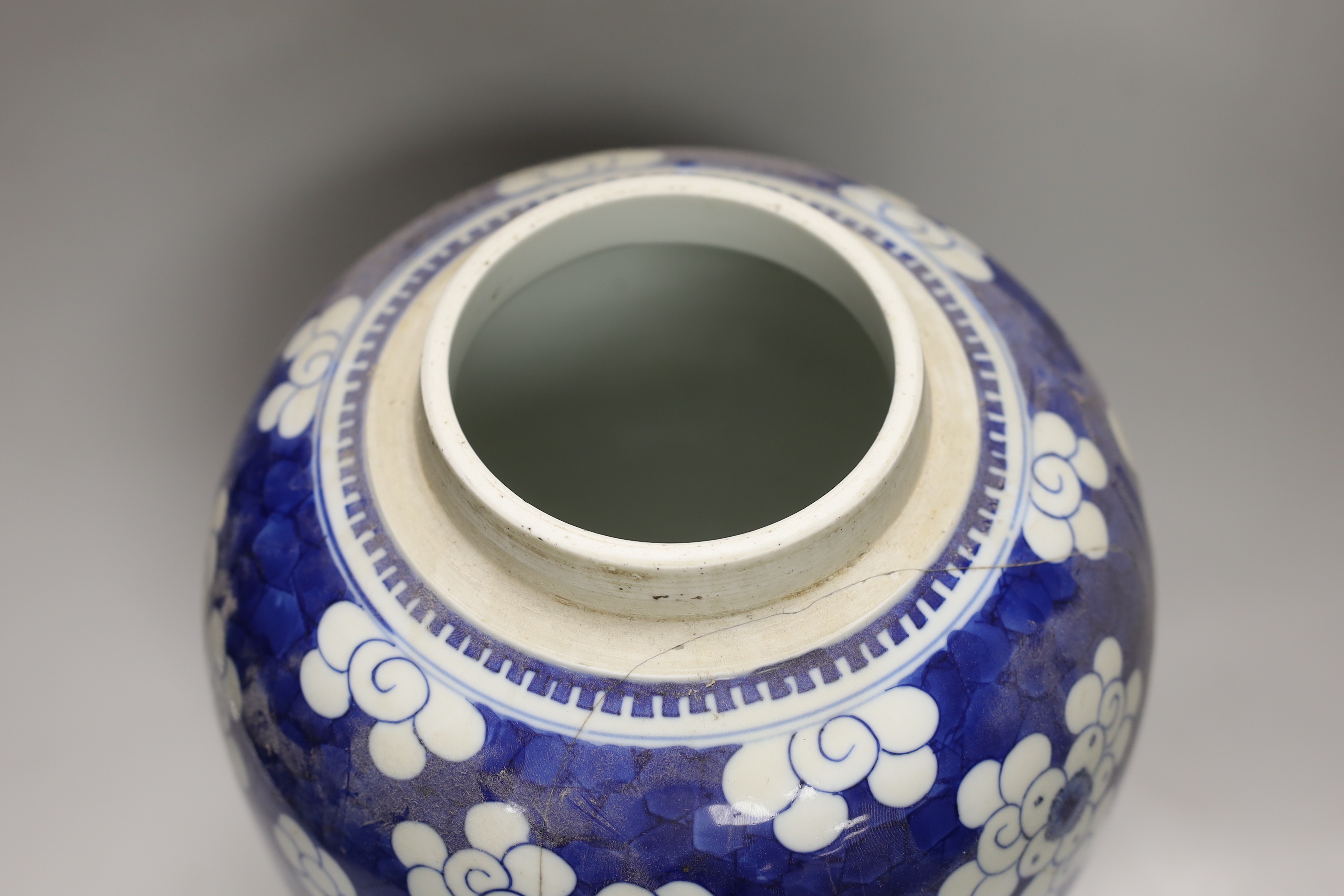 A large Chinese blue and white prunus pattern vase, with carved hardwood cover, 42cm (a.f.)